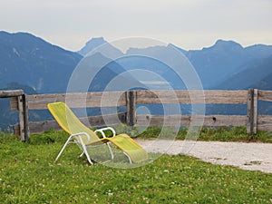 Yellow Sun Chair on Top with Mountain Background