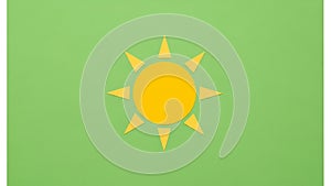Yellow sun symbol with eight triangular rays on a light green background