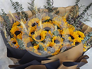 Yellow Sunflower, Statice, Sea lavender, marsh rosemary, brown and dark blue color a bouquet of flowers beautiful, fresh flower,