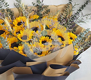 Yellow Sunflower, Statice, Sea lavender, marsh rosemary, brown and dark blue color a bouquet of flowers beautiful, fresh flower,