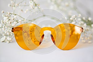 Yellow sunglasses with delicate flower decor