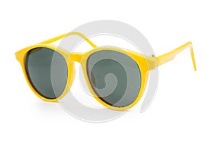 Yellow sunglasses on white background