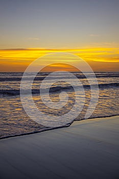 Yellow sunset on the beach. Seascape for background. Colorful sky. Beautiful water reflection. Sunlight on horizon line. Nature