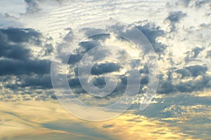 Yellow Sunset with dark clouds above splotched over top part of sky