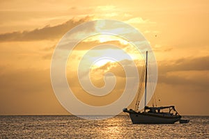 Yellow sunset with sailboat