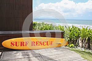 Yellow surf rescue board by the sea