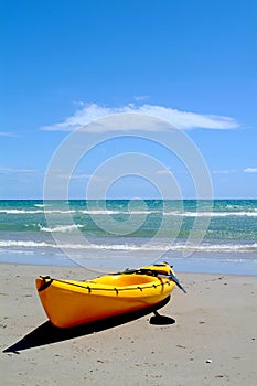 Yellow surf rescue canoe