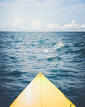 Yellow surfboard on the sea