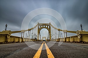 Yellow suspension bridge in Pittsburgh Pennsylvania.