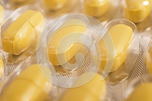 Yellow tablets closeup of
