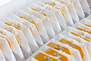Yellow tagged teabags.