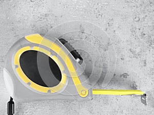 yellow tape measure on a ultimate grey background