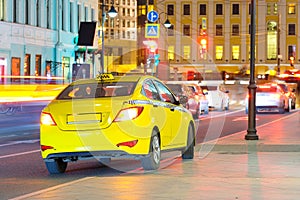 Yellow taxi in a center of Moscow