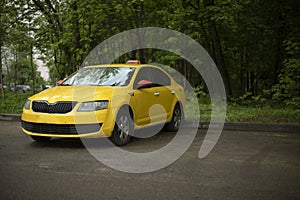 Yellow taxi in parking lot. Car in city. Taxis parked in yard