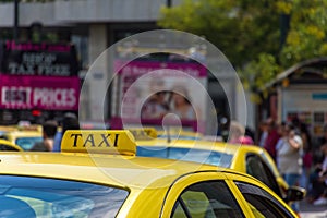 Yellow taxi sign on cab vehicle roof