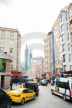 Yellow taxis and cars on a narrow road