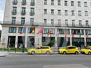 Yellow taxis line up in front of the Ritz-Carlton Hotel. Budapest, Hungary