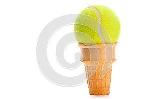 A yellow tennis ball in an ice cream cone