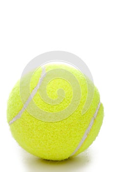 A yellow tennis ball on a white background