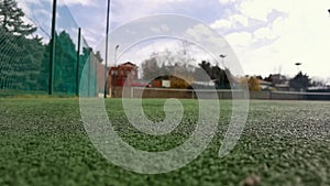 Yellow tennis balls in super slow motion 1000 fps on a clay green court next to the white line with copy space, soft