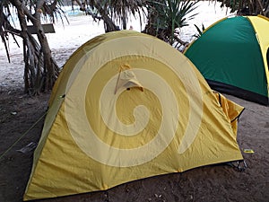Yellow Tent at outside seashores in the daylight photo