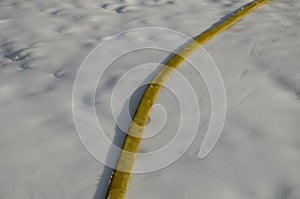 Yellow textile fire hose. it is used by ski owners to connect water to snow cannons and turbines with nozzles for the production o