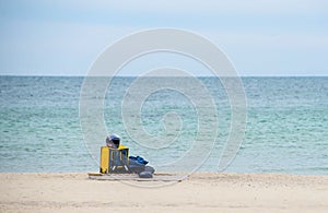 Yellow thermal bag of a food delivery man on the seashore. Fast delivery groceries and food orders from restaurants and