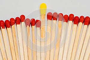 Yellow tipped match with red tipped matches