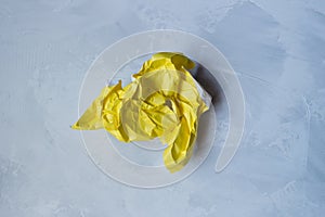 Yellow torn and crumpled paper