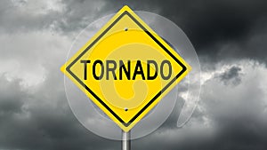 Yellow tornado warning sign and dark clouds