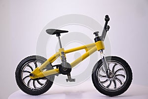 Yellow toy bike mockup with black background BMX horizontal