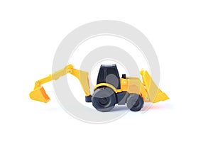 The yellow toy car Bulldozer-Excavator isolated on white background. Children`s backhole toy model