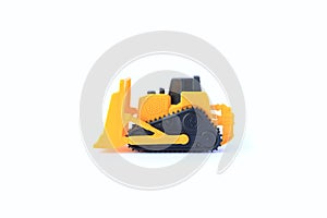 The yellow toy car Bulldozer isolated on white background. Children`s tractor toy. Wheel loader construction car model