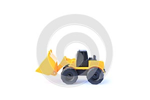 The yellow toy car Bulldozer isolated on white background. Children`s tractor toy. Wheel loader construction car model