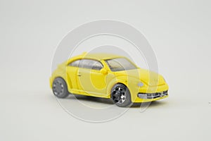A yellow toy car in an enlarged size