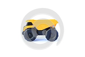 The yellow toy car heavy truck isolated on white background