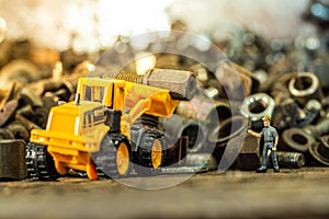 Yellow toy dump truck and typewriter tractor bulldozer
