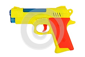 A yellow toy gun. On a white background, isolated