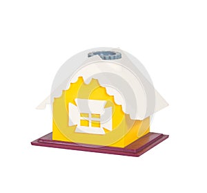 Yellow toy house model isolated on white background