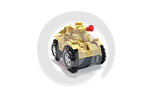 Yellow toy tank isolatedâ€‹ onâ€‹ whiteâ€‹ background.â€‹ Receptive Language forâ€‹ kid.