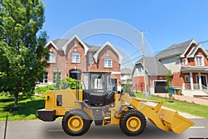 Yellow tractor on a city street