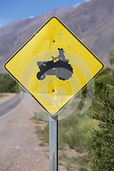 Yellow tractor crossing road sign, Argentina