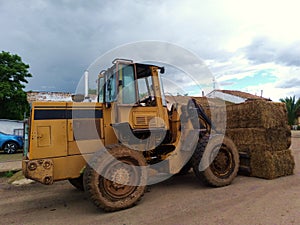 Tractor transporting straw photo