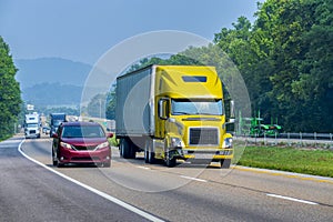 Yellow Tractor-Trailer Traveling On Tennessee Interstate Highway