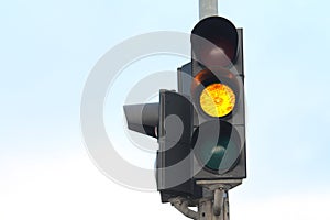 Yellow traffic light isolated