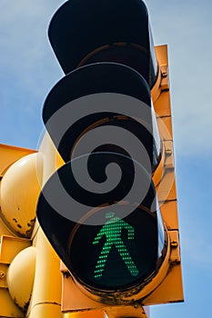 Yellow Traffic light with a luminous green signal