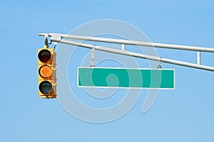 Yellow traffic signal light with sign
