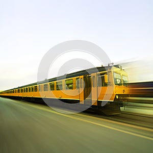 Yellow train in full speed