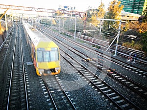 Yellow Train running on track in fast speed motion image.