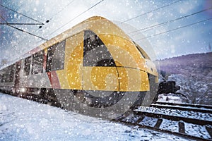 Yellow train in the snow